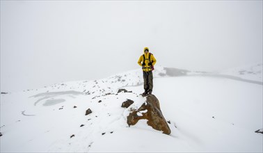 Hiker standing on stone