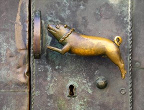 Pig figure as door handle