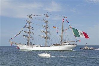 Mexican Bark Cuauhtemoc leaves the Hanse Sail with sailors in the masts