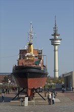 Tugboat Stier at the Museumshafen and Radio Tower