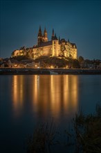 Castle hill with cathedral and Albrechtsburg castle reflected in the river Elbe at the Blue Hour