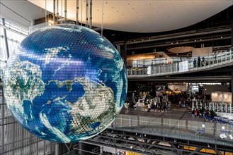 Big globe hangs from the ceiling