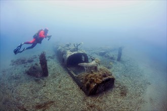 Wreck of a North American B25 bomber Mitchell from World War II with diver