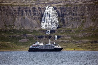 Cruise ship anchored in a fjord