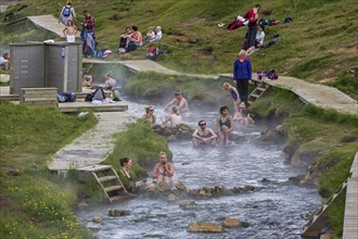 Bathing people in the hot thermal springs Reykjadalur