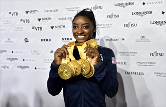 Simone Biles USA presents her 5 gold medals of the World Championships in Gymnastics