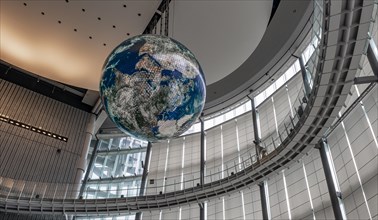 Big globe hangs from the ceiling