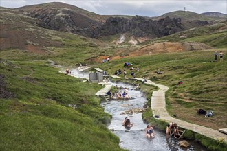 People bathing in the hot thermal springs Reykjadalur