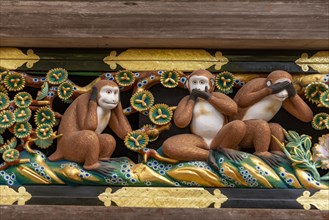 Carving of the three monkeys on the facade of the holy stable