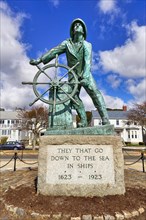 Bronze statue of a man at the wheel