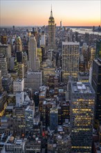 View of Midtown and Downtown Manhattan and Empire State Building from Top of the Rock Observation Center at sunset