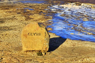 Red stone with the inscription Geysir