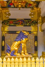 Guardian statue at the golden decorated Yomeimon Gate