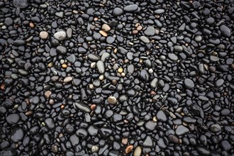 Black lava pebbles at Reynisfjara Beach