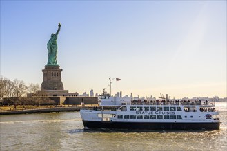 Statue of Liberty with passenger boat