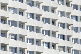 Monotonous house facade with balconies on a white residential house