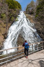 Woman in front of Yudaki Waterfall