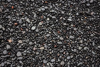 Black lava pebbles at Reynisfjara Beach