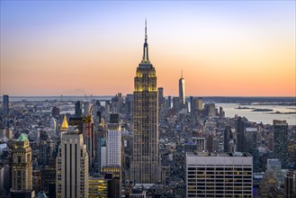 View of Midtown and Downtown Manhattan and Empire State Building from Top of the Rock Observation Center at sunset