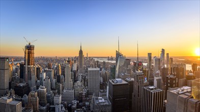 View of Midtown and Downtown Manhattan and Empire State Building from Top of the Rock Observation Center at sunset