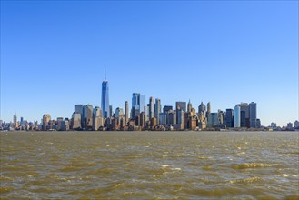 View from Ellis Island to the skyline of Lower Manhattan with skyscrapers