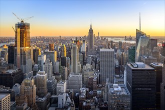 View of Midtown and Downtown Manhattan and Empire State Building from Top of the Rock Observation Center at sunset