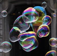 Large soap bubbles fly through the air