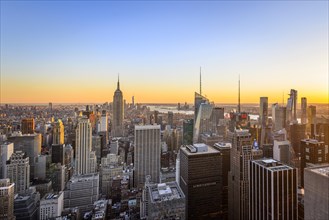 View of Midtown and Downtown Manhattan and Empire State Building from Top of the Rock Observation Center at sunset
