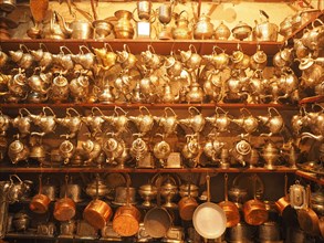 Shop with traditional silver and brass crockery