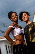 Two smiling young latin women