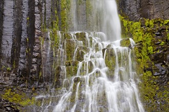 Waterfall over mossy rocks
