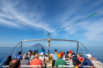 Excursion boat with view on Stromboli island with volcano