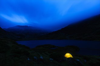 Illuminated tent at night