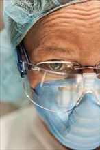 Scientist in necropsy lab wearing safety equipment