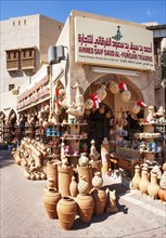 Clay jugs in front of souvenir shop