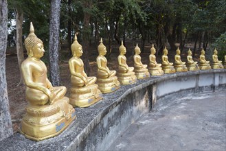 Row of Buddha statues at wat Ko Phayam temple