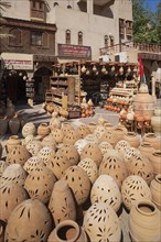 Clay jugs in front of souvenir shops