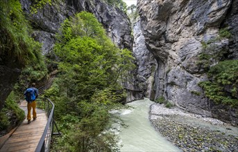 Young man hiking in the Aare gorge in the Haslital