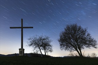 Herbele cross at night with starry sky