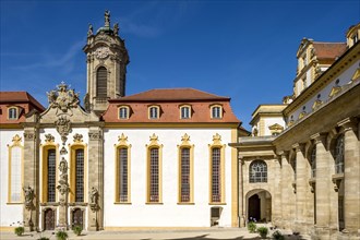 Castle courtyard with baroque castle church and colonnades