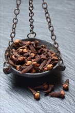 Cloves in a weighing pan