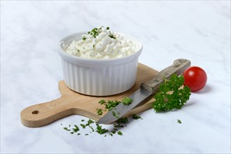 Cream cheese with parsley in bowl