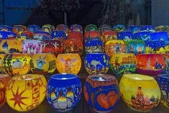 Colourful painted illuminated lanterns with christmas motives