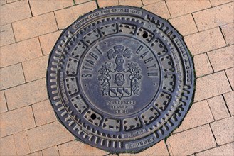 Manhole cover with the city arms