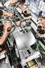 Robots welding a car at Mercedes-Benz