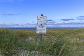 No trespassing Sign and warning sign in the dunes on the Baltic Sea beach