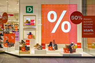 Shop window with large percent sign