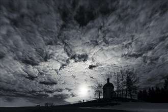 Buschel chapel with photographer in the moonlight
