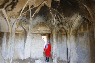 Iranian woman inside the ruins of Qatruyeh castle