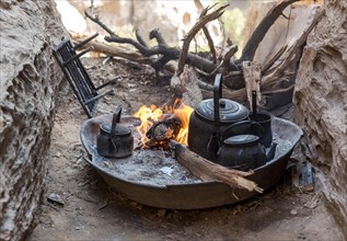 Traditional preparation of tea on wooden fire